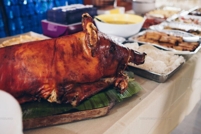 What Preparation Method Gives Lechon Its Crispy Skin and Moist Interior?